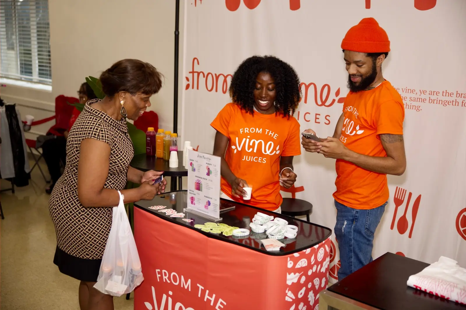 The From the Vine team serving customers at their market stand